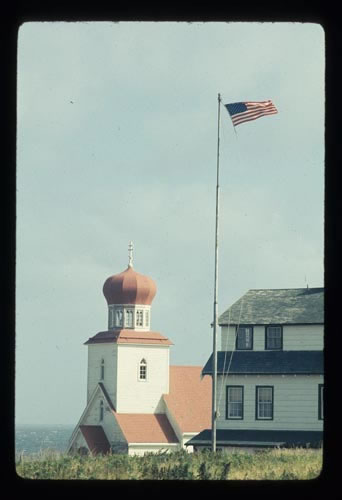 Photo of church steeple, Company House, and the flag pole.
