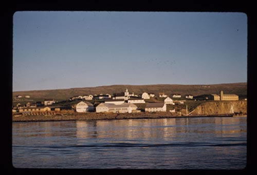 Photo of St. George village from the water in the evening.