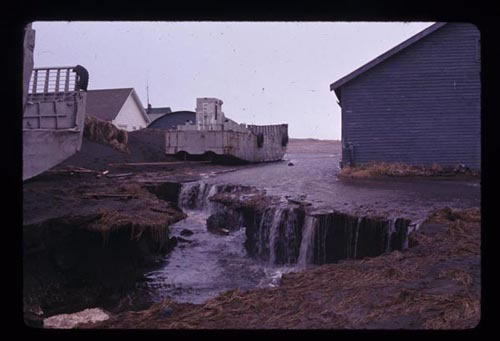 Photo of landing crafts and washed away soils from flood.