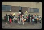 Thumbnail photo of adults and children with balloons at 4th of July Celebration.
