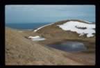 Thumbnail photo of Polovina crater and lake with residual snow.