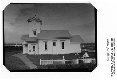 Photo of Saints Peter and Paul Russian Orthodox Church, a small white church with a picket fence.