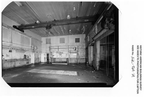 Photo of the interior of the machine shop, an open space with a high ceiling.