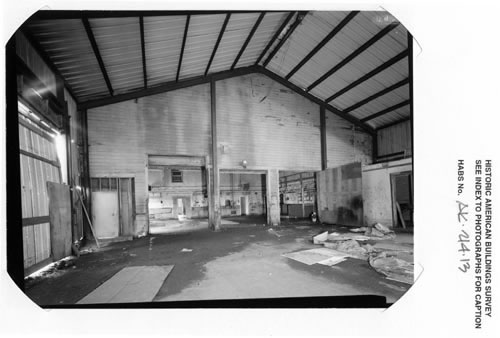 Photo of the interior of the machine shop, an open space with a high ceiling.