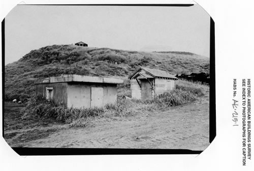 Photo of two small buildings that are  salt water well pumphouses.