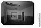 Thumbnail photo of the empty living room of House 101.