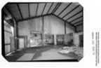 Thumbnail photo of the interior of the machine shop, an open space with a high ceiling.