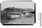 Thumbnail photo of two small buildings that are  salt water well pumphouses.