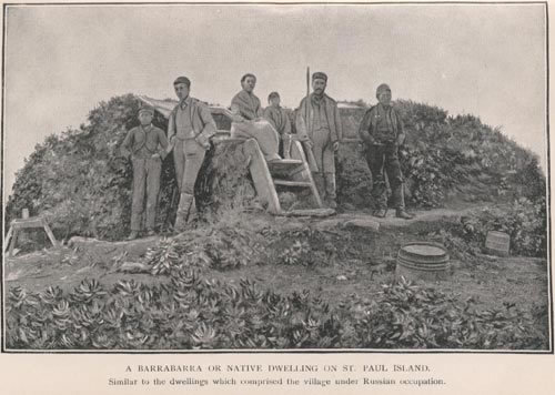 Photo of a historic picture of a group of people in front of a sod dwelling at Barrabarra.