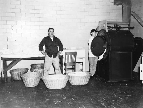 Photo of John Krukoff and Maxim Buterin, Jr standing among wicker baskets.