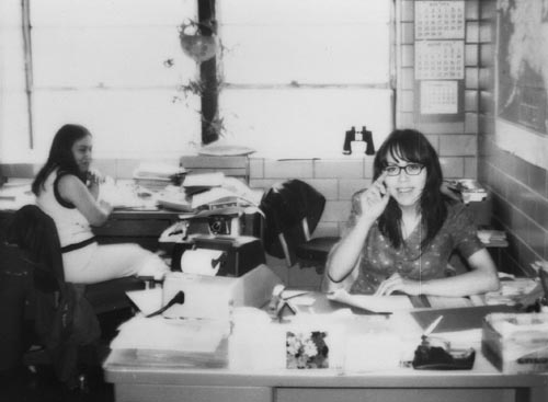 Photo of two women in an office.