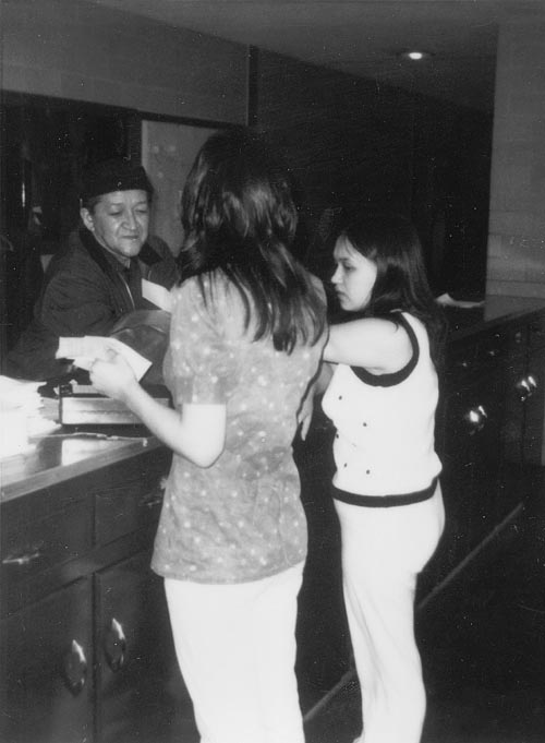 Photo of women working at front counter at the store.
