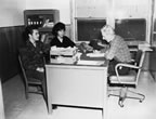 Thumbnail photo of Nick Kozloff, Sr. and Lena Lekanoff seated in front of a desk.