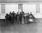 Thumbnail photo of children outside of building.