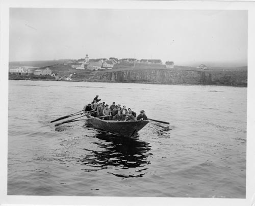 Photo of men leaving St. George in baidar.