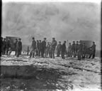 Thumbnail photo of men lined up at cannons.