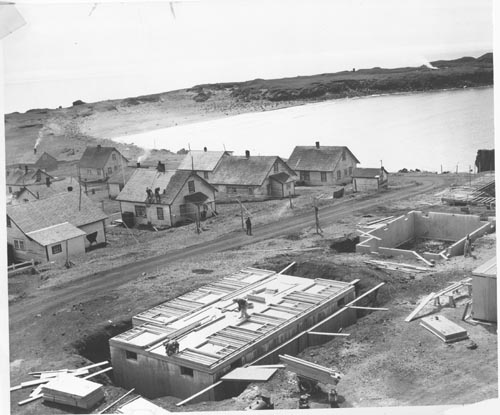 Photo of construction of wooden houses in St. Paul Village.