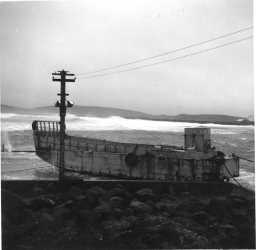 Photo of landing craft near power line.