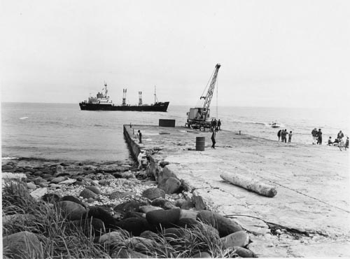 Photo of dock with Pribilof ship in background.