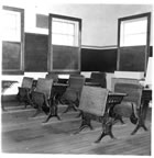 Thumbnail photo of wooden school desks.