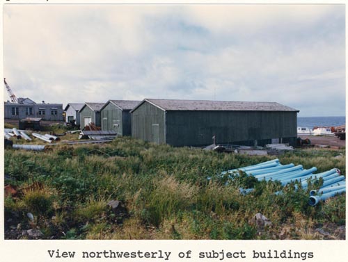Photo of northwesterly view of four warehouse buildings, lots 12 and 13 of Tract 43.