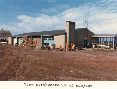 Photo of northwesterly view of the Tanaq Carpenter Shop, lot 19 of Tract 43.