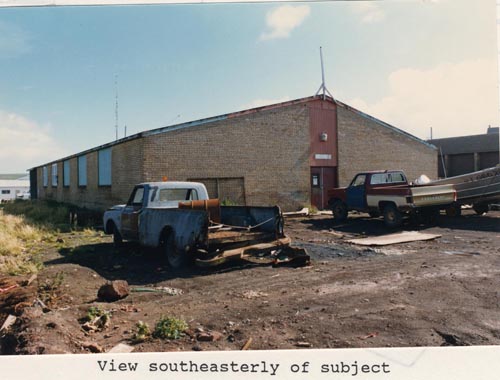 Photo of southeasterly view of the Tanaq Carpenter Shop, lot 19 of Tract 43.
