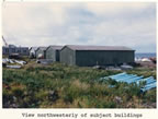 Thumbnail photo of northwesterly view of four warehouse buildings, lots 12 and 13 of Tract 43.