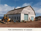 Photo of barn-shped building.