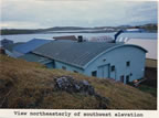 Thumbnail photo of northeasterly view of the southwest elevation of the Machine Shop.
