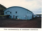 Thumbnail photo of northwesterly view of the southeast elevation of the Machine Shop.