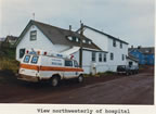 Thumbnail photo of northwesterly view of the hospital with ambulance in front.