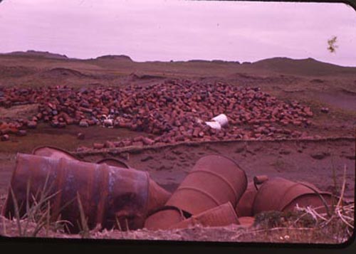 Photo of large piles of barrels.