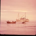 Thumbnail photo of men in baidar unloading boat.