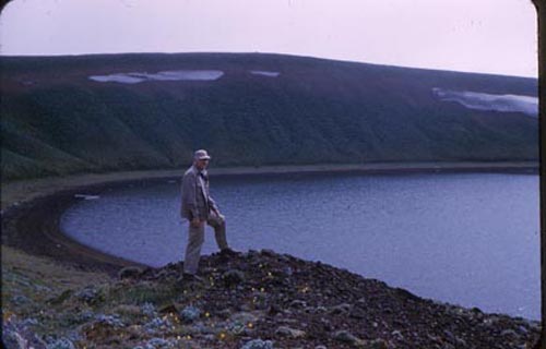 Photo of man standing on bluff.