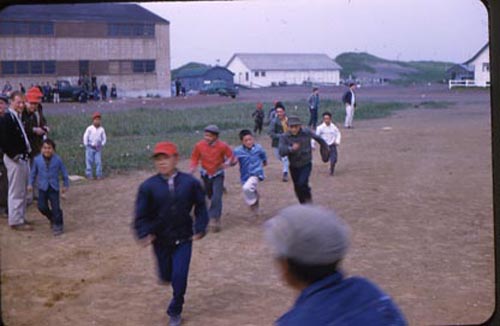 Photo of boys running at baseball game.
