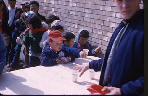 Photo of children getting beverages from the Fouke Fur Company.