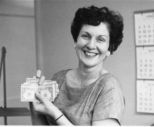 Photo of women holding money.