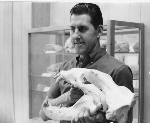 Photo of Al Roppel holding mammoth skull.
