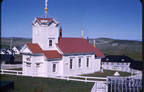 Photo of white church.