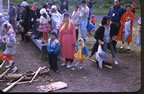 Thumbnail photo of a group of children and adults.