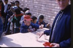 Thumbnail photo of children getting beverages from the Fouke Fur Company.