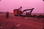 Thumbnail photo of crane digging along road (site of the present-day USCG Loran Station).