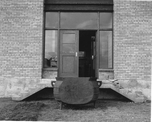 Photo of large kettle outside of the biologists' laboratory (now community store).