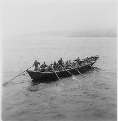 Photo of men rowing a baidar.