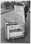 Thumbnail photo of zookeeper with open crate outside of the Seattle Zoo after Baltzo brought a fur seal to the zoo.