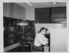 Thumbnail photo of man sitting at desk in laboratory.