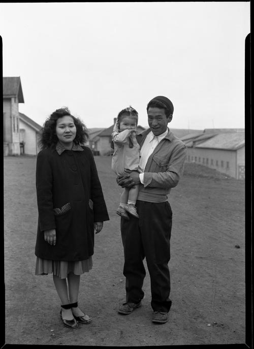 Photo of man, woman, and young child.