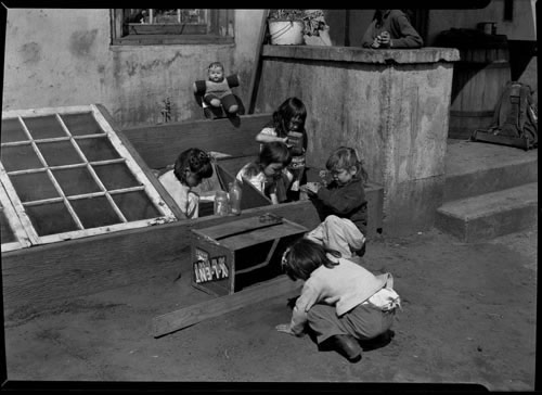 Photo of six young children playing by House number 1 (Mandregan household at the time). Mary C. Bourdukofsky is second above center.