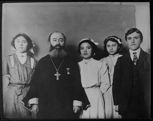 Photo of priest and family.